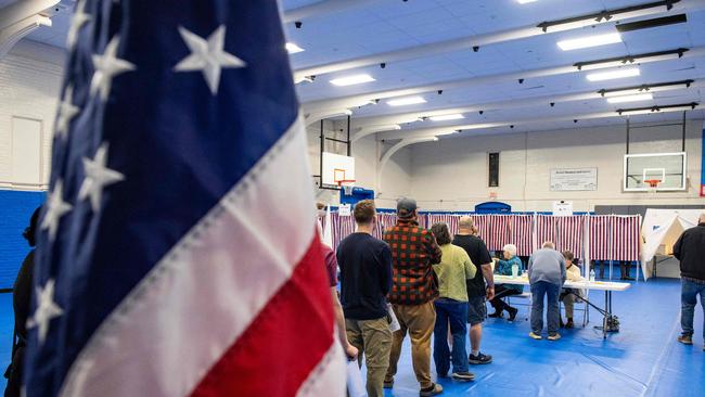 People wait in line to vote at the Green Street Community Center in Concord, New Hampshire, on November 5, 2024. (Photo by Joseph Prezioso / AFP)