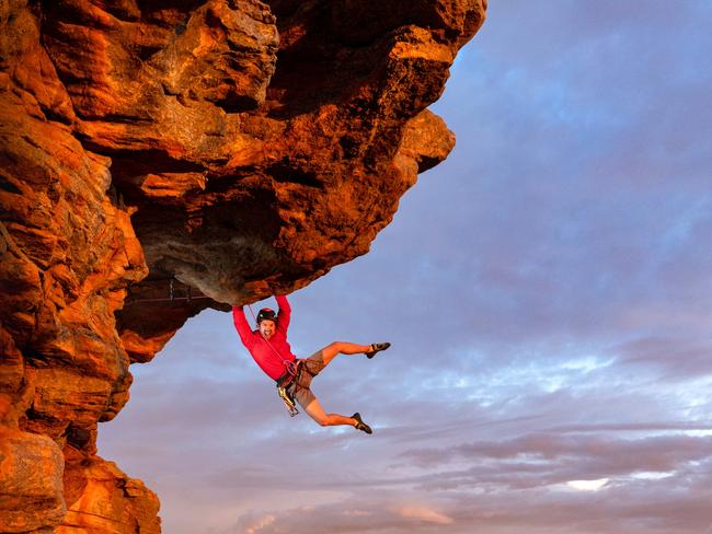 EMBARGO 6AM SATURDAY 6TH APRIL ** WARNING DO NOT USE EMBARGO CONTACT SARAH MATRAY HS PIC DESK IF ANY QUESTIONS** Free climber Tom Perkins swings out on Feeling the Ceiling, a grade 21 climb near the summit of Mount Arapiles at first light. With over two thousand climbs in such a concentrated area of rock this collection of cliffs and gullies is internationally renowned for its quality of climbs and rock, with people traveling from all over to climb here. With climbing bans over large areas already in place due to cultural heritage concerns and more likely to follow, the climbing community are struggling to push back against Parks Victorias broad approach. Picture: Jason Edwards