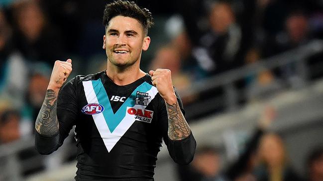 Chad Wingard celebrates a goal.