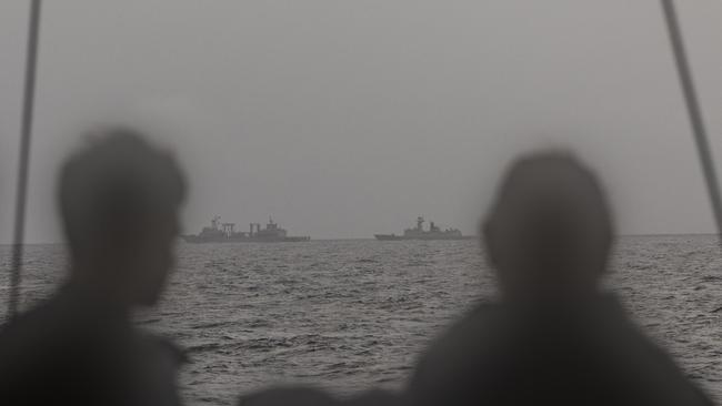 Royal Australian Navy sailors on HMAS Arunta keeping watch on People's Liberation Army-Navy Fuchi-class replenishment vessel Weishanhu and Jiangkai-class frigate Hengyang in the Tasman Sea. Picture: Defence