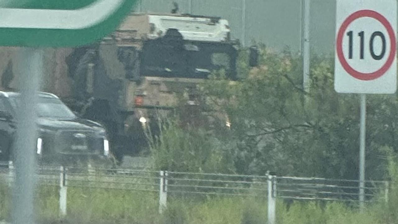 An ADF vehicle seen on the M1 in the northern Gold Coast on Monday.