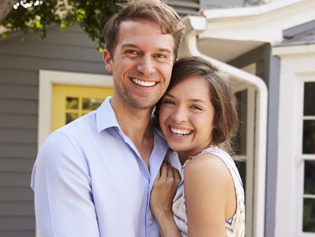 A couple who have just signed up a mortgage after buying their first house. Generic first home buyers Picture: iStock.