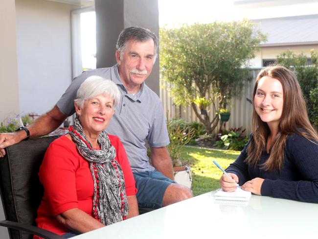 LOCKED IN: Bribie Island residents Vicky and Greg Beh with reporter Vanessa Marsh. Picture: AAP Image/Steve Pohlner