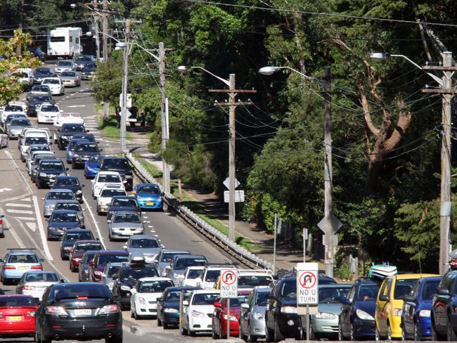 A long line of cars caught in a traffic jam along the Pacific Highway at Wahroonga waiting to get onto the M1 motorway.