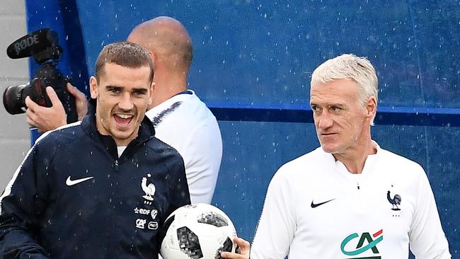 France's forward Antoine Griezmann (L) with head coach Didier Deschamps attend a training session at the Glebovets stadium in Istra, some 70km west of Moscow. AFP PHOTO / Franck FIFE