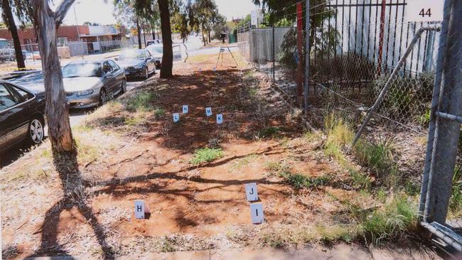 Evidence markers on the footpath outside the warehouse. Picture released by Supreme Court.