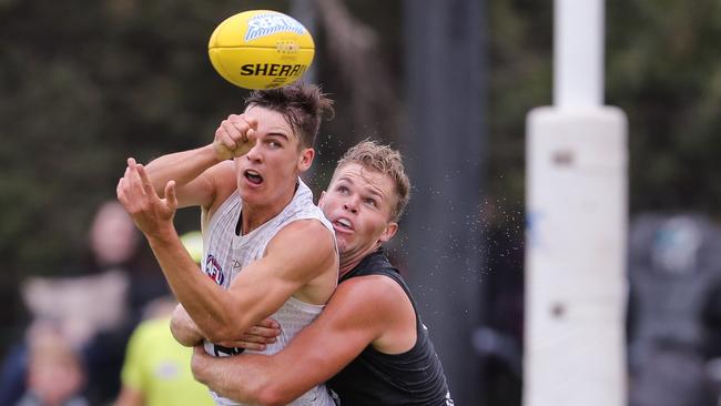 ADELAIDE, AUSTRALIA - FEBRUARY 14: Connor Rozee is tackled by Dan Houston during the Port Adelaide Power Intra-Club match at Alberton Oval on February 14, 2020 in Adelaide, Australia. (Photo by Matt Turner/AFL Photos via Getty Images)