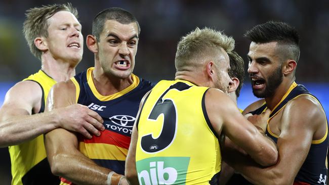 Tempers flare between Jack Riewoldt, Taylor Walker, Brandon Ellis and Wayne Milera. Picture: Sarah Reed