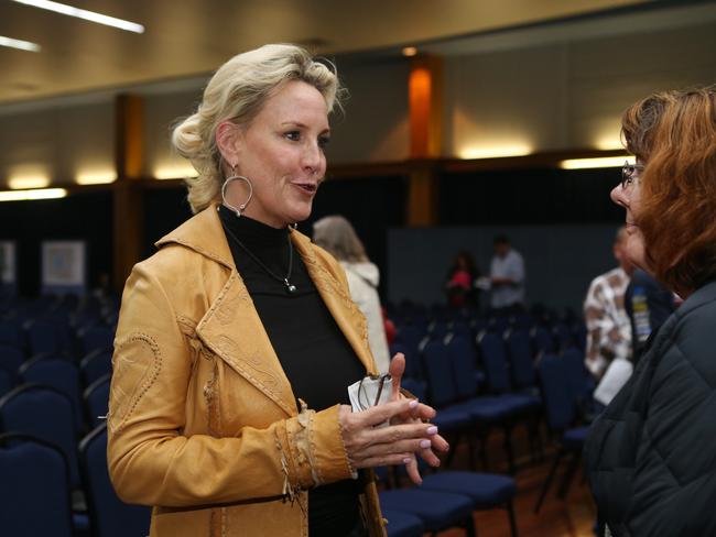 Erin Brockovich speaking with residents after a community meeting in Oakey, Queensland. Picture: Tara Croser