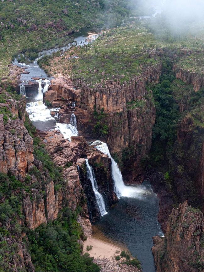 Kakadu’s Twin Falls shrouded in cloud in the morning light. Picture: Che Chorley