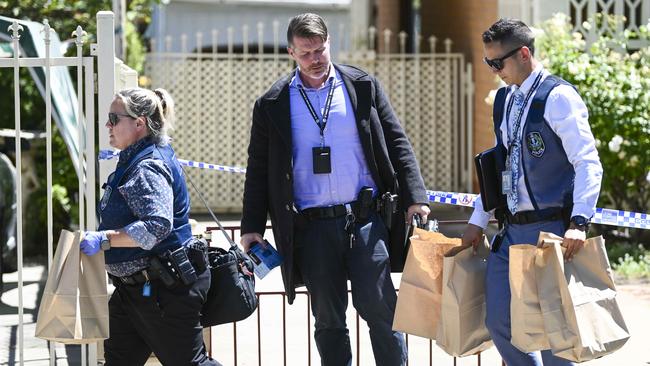 Police Major Crime officers remove bags of evidence during the investigation into the double murders of Antoinette Tozer, 76, and her son Steve, 55, at heir home on Rosetta Street, Rosewater. Picture: Mark Brake