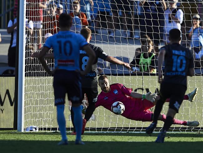 SYDNEY, AUSTRALIA - FEBRUARY 03: Andrew Redmayne of Sydney makes a save against a penalty kick during the round 17 A-League match between Sydney FC and Melbourne City at WIN Jubilee Stadium on February 03, 2019 in Sydney, Australia. (Photo by Brett Hemmings/Getty Images)