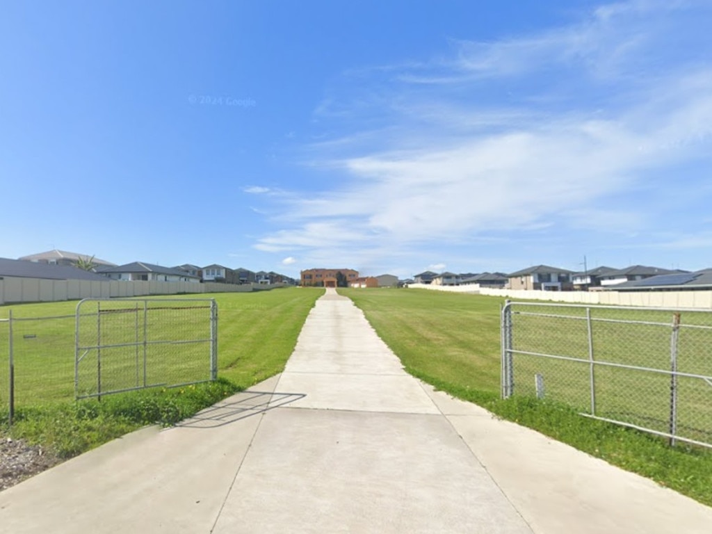 The Zammit family home looks tiny at the end of the 200m-long driveway.