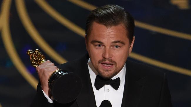 Actor Leonardo DiCaprio accepts the award for Best Actor in,The Revenant on stage at the 88th Oscars on February 28, 2016 in Hollywood, California. AFP PHOTO / MARK RALSTON