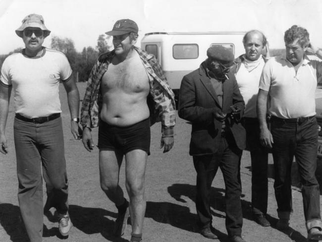 On-the-run child killer James George Smith was recaptured in scrubland through the skill of tracker Jimmy James, centre.Also pictured  are SA Police officers Det Sgt Sid Thomas, Det Rod Trussell and Det Bob Lindner.