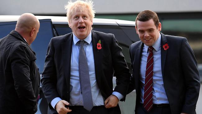 British Prime Minister Boris Johnson, centre, with Douglas Ross, right. Picture: AFP