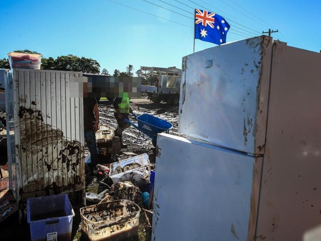 Faces pixelated for court story. Residents clean a flood-damaged house at Glenthorne on May 24, 2025 in Taree. Photo by Roni Bintang/Getty Images.