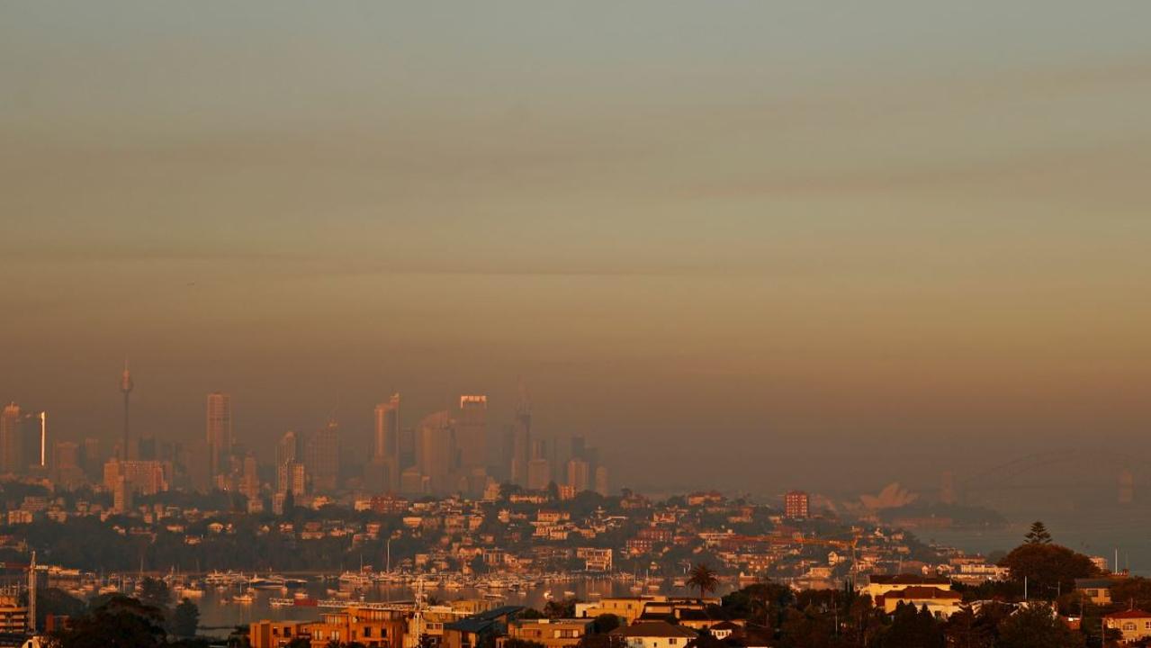 The Harbour Bridge is barly visable as smoke shrouds Sydney's CBD this morning. Picture: Getty