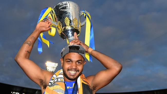 Rioli with the Premiership Cup at the MCG after the win against Collingwood. Picture: Getty