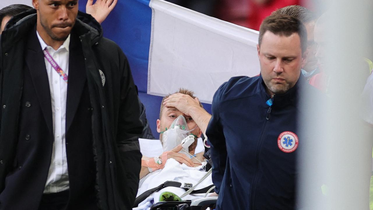 Christian Eriksen is evacuated after collapsing on the pitch. Picture: AFP