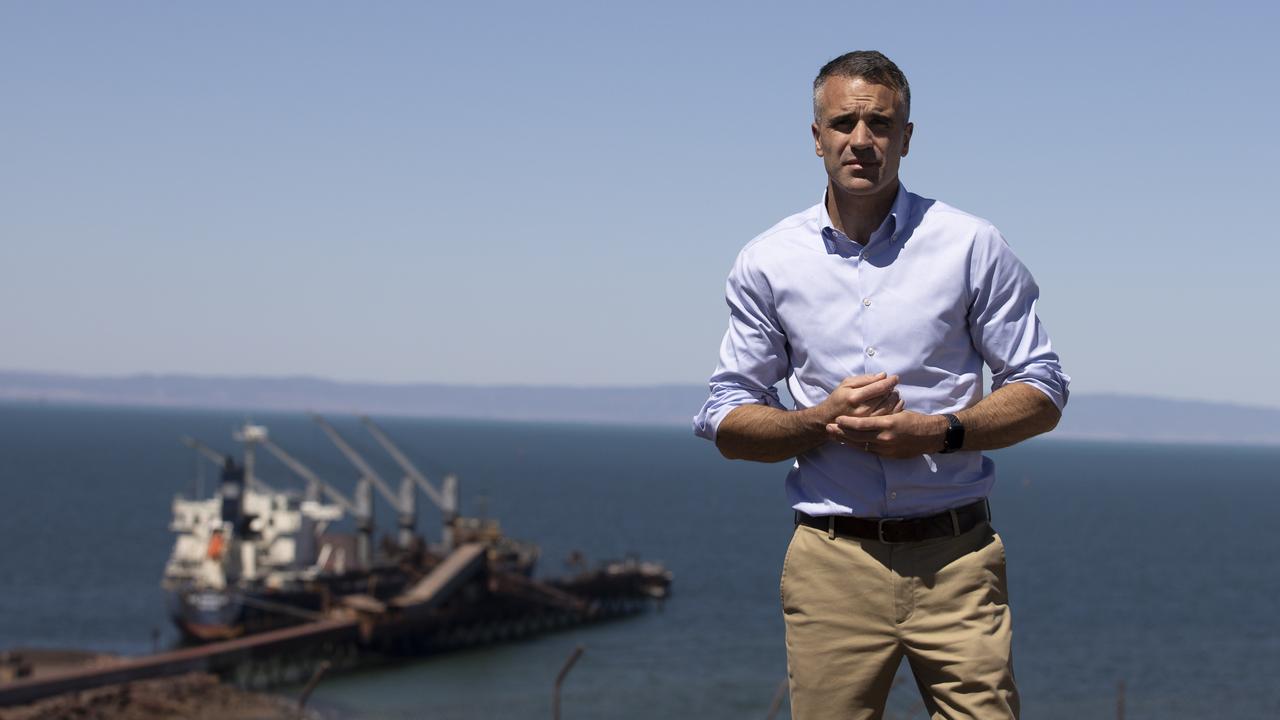 Premier Peter Malinauskas stands on Hummock Hill Lookout in Whyalla, overlooking a ship at No.2 Ore Jetty at Whyalla Steelworks. Picture: Brett Hartwig