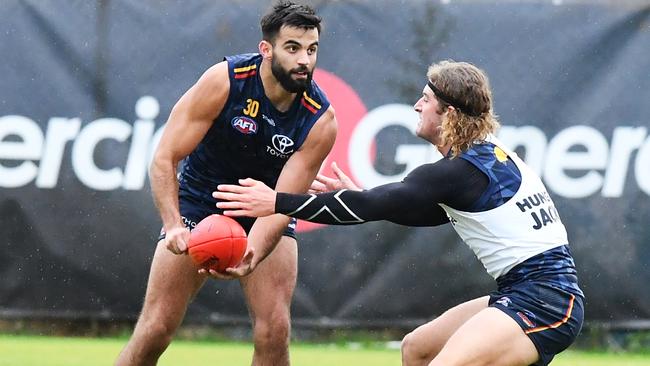 Wayne Milera of the Crows handballs during training. Picture: Mark Brake