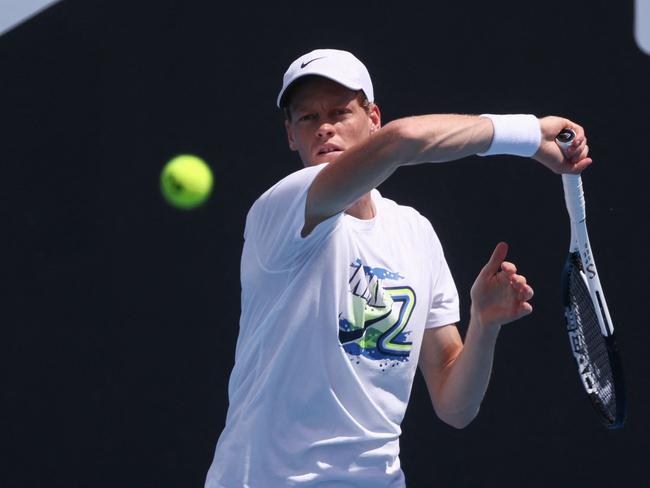 Italy's Jannik Sinner hits a return during a practice session ahead of the Australian Open tennis tournament in Melbourne on January 10, 2025. (Photo by David GRAY / AFP) / -- IMAGE RESTRICTED TO EDITORIAL USE - STRICTLY NO COMMERCIAL USE --