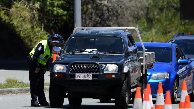 Police perform checks on the NSW/QLD border in Coolangatta on the Gold Coast. Picture: NCA NewsWire / Dan Peled