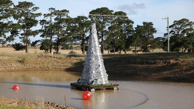 A group of Sutherlands Creek residents have banded together to give Geelong a run for it's money by making their own floating Christmas tree on a local dam. Picture: Alan Barber