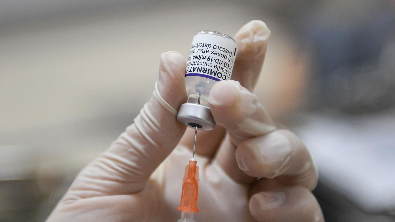 The man said he grabbed the syringe but denied having touched a worker. Photo by Nhac NGUYEN / AFP)