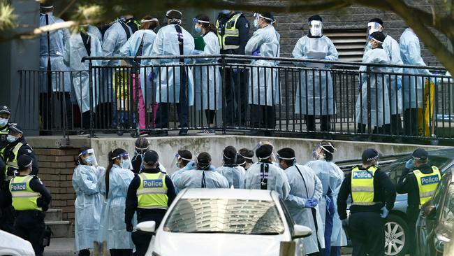 Health professionals and police in Melbourne in July, 2020. Picture: Getty Images