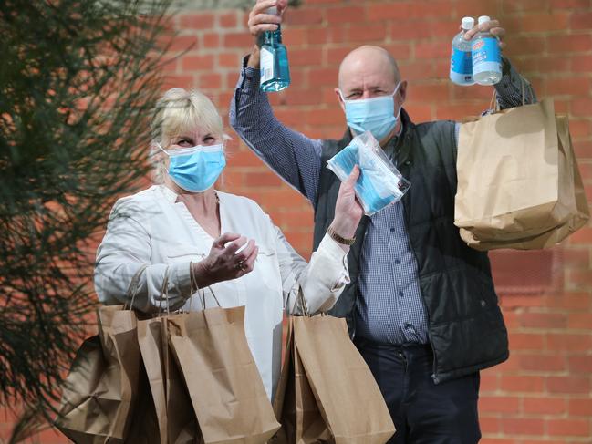 Volunteering Geelong CEO Helen Hunter and Volunteer Vaughan Lamb. Volunteering Geelong has been coordinating a team of 30 volunteers to distribute hygiene packs containing sanitiser, disinfectant, disposable gloves, and disposable masks to 200 local households including those of people who have tested positive to coronavirus. Picture: Peter Ristevski