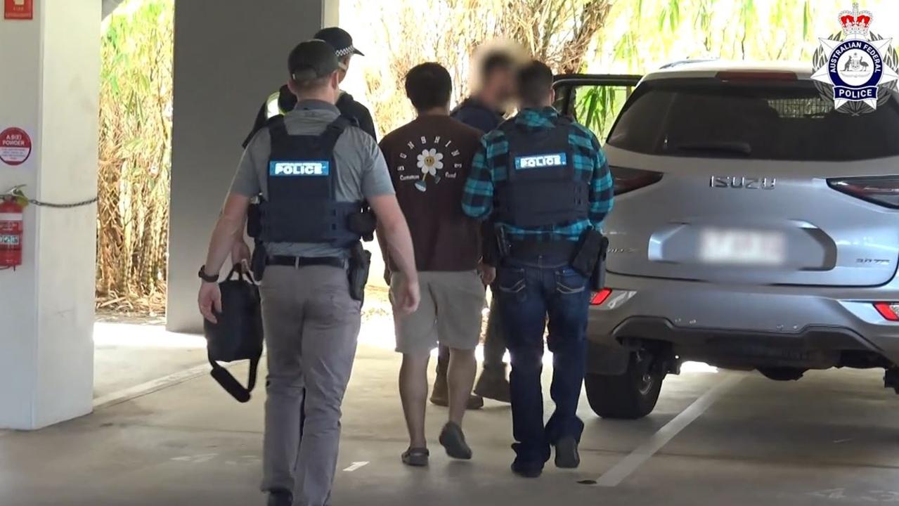 Australian Federal Police officers have charged a 22-year-old Johnston man with one count of people smuggling. Picture: AFP