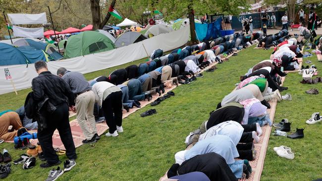 TPeople pray as pro-Palestinian students protest at an encampment on the campus of the University of Michigan. Picture: AFP