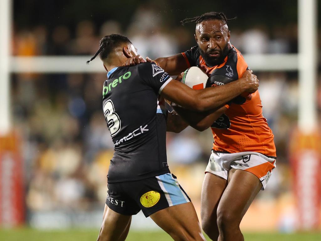 (L-R) Jesse Ramien and Justin Olam come to grips during the Wests Tigers win over the Sharks in round three. Picture: NRL Imagery