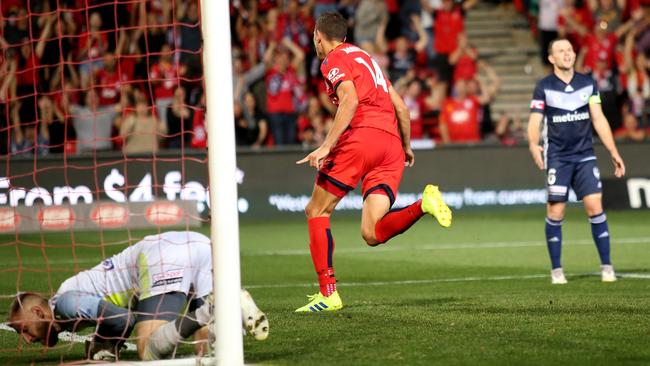 Adelaide United’s George Blackwood celebrates his late winner against rival Melbourne Victory at Hindmarsh Stadium last season. Picture: AAP Image/David James Elsby