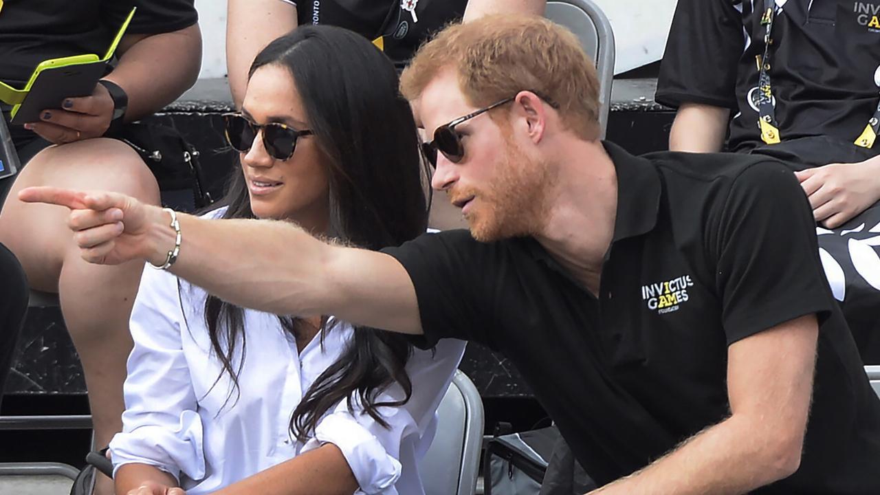 Prince Harry and his then girlfriend Meghan Markle attend a wheelchair tennis event at the Invictus Games in Toronto. Picture: Nathan Denette/The Canadian Press via AP