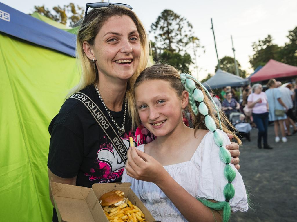 Jade Wright and niece Maddison-Lee Jackson with food from Flaming Knights at Twilight Eats at the Windmills, Saturday, November 18, 2023. Picture: Kevin Farmer