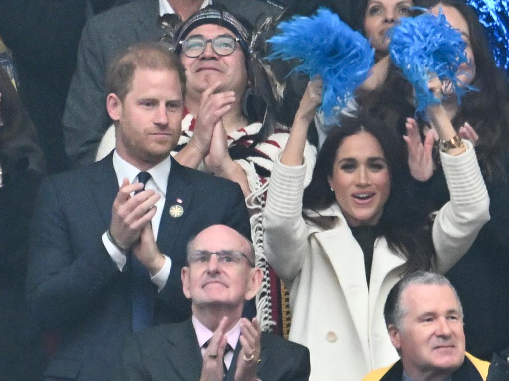 Meghan showed her support for the athletes by waving pompoms in the air. Picture: Samir Hussein/Samir Hussein/WireImage