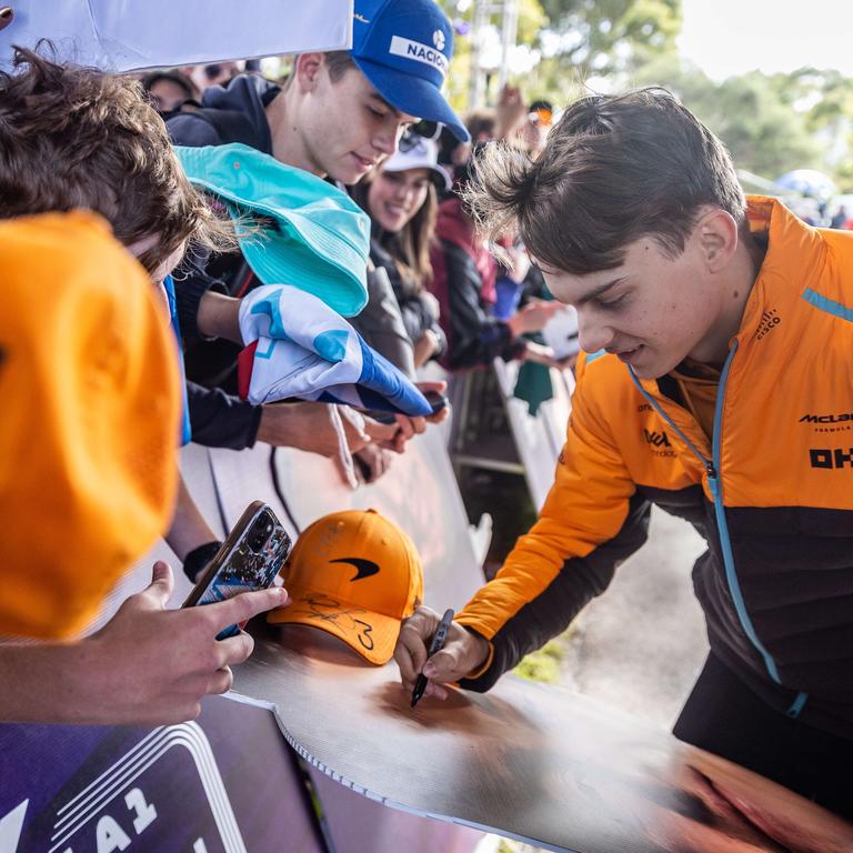 Aussie Oscar Piastri signs autographs for local fans. Picture: Jake Nowakowski