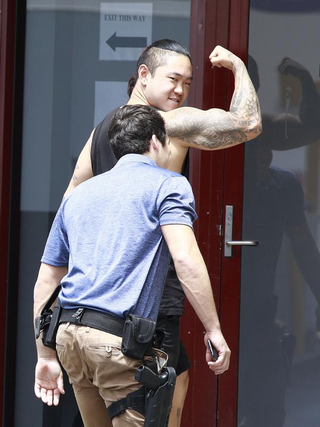 Tae-Ook Kim, 22, being taken into the Southport Watchhouse. Pic Tertius Pickard