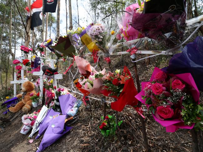 Flowers at the scene of the crash on the M1 in Coomera in which driver Jordan Hayes-McGuinness and four other young people lost their lives. Picture: Adam Head.