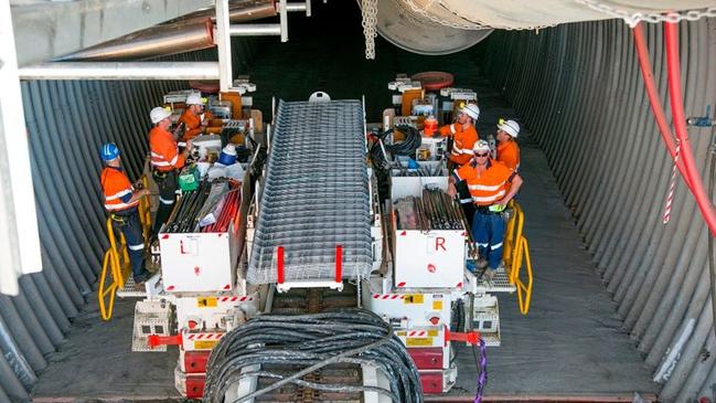 Workers on a continuous miner at a Bowen Basin underground mine. Note: This is not the continuous miner or mine referred to in this article.