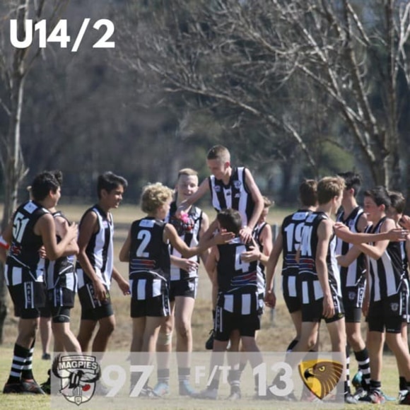 The under 14s team at the end of their grand final.