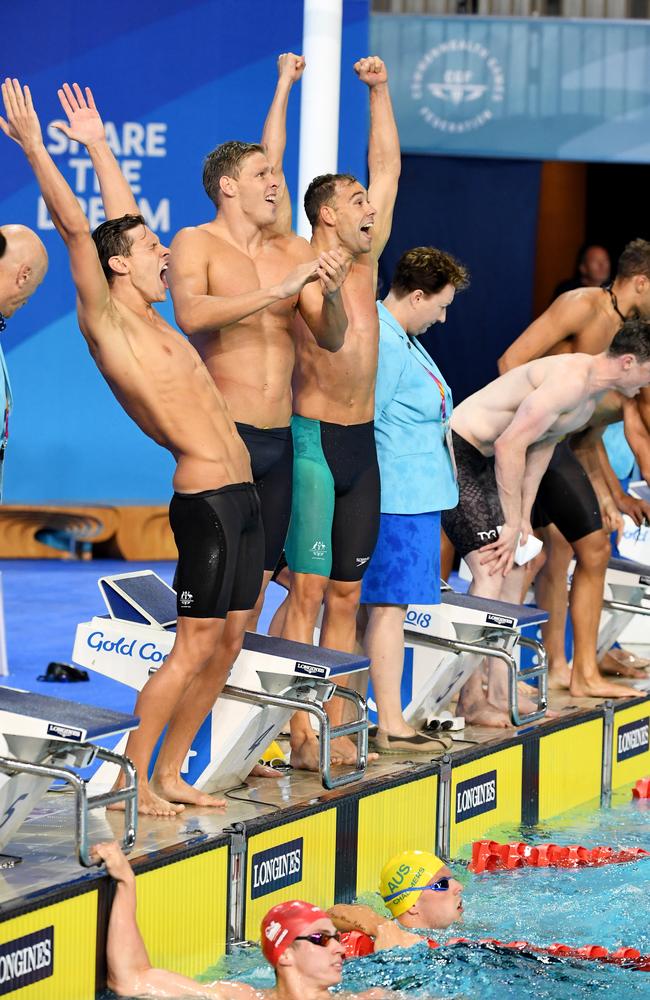 Kyle Chalmers of Australia (pool) celebrates with his team mates after winning the Mens 4x100m Medley Relay