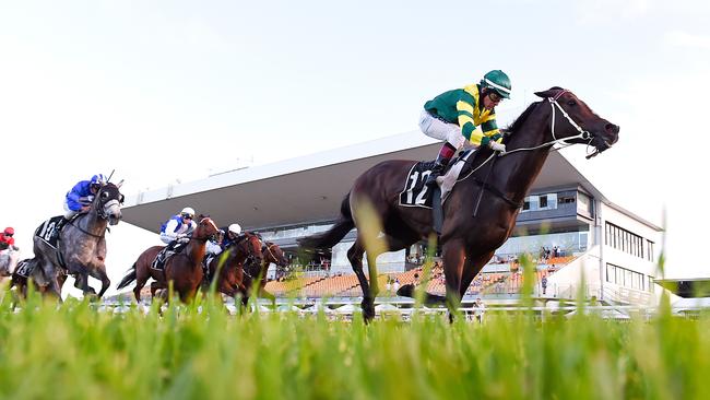 Jockey Jeff Lloyd rides Care To Think to win Race 9, the Class 6 Plate, during the Doomben Race Day in Brisbane. Picture: AAP