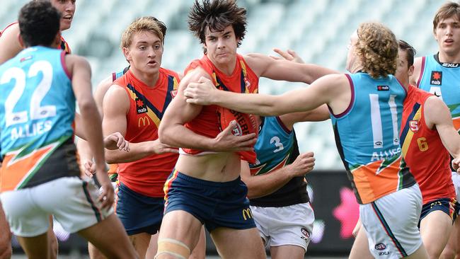 GET OUT OF MY WAY: Darcy Fogarty displays his brute strength for SA against the Allies during this year’s AFL under-18 championships. Picture: Roger Wyman.