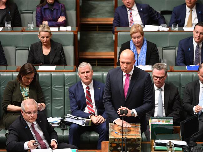 Minister for Home Affairs Peter Dutton bites back during Question Time in the House of Representatives on Wednesday.