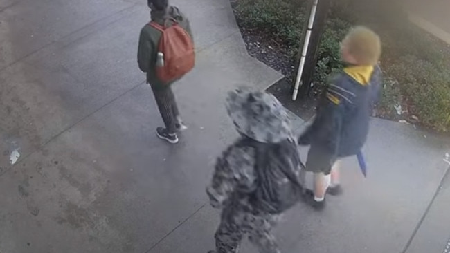 Supplied screen grabs from CCTV camera of the 14- year-old who has been arrested today over the alleged stabbing at Sydney University of a 22-year-old. The boy is seen wearing a camouflage outfit including camouflage bucket style hat. This footage is about five minutes after the stabbing. Picture: Supplied