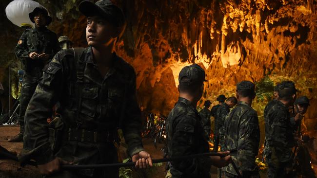 Discovery Channel's Thai Cave Rescue special shows Thai soldiers relaying electric cable deep into the Tham Luang cave Picture: LILLIAN SUWANRUMPHA/AFP/Getty Images)